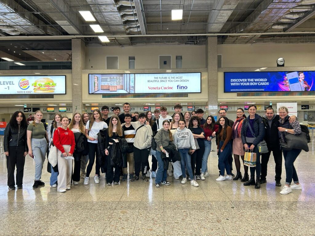 Picture of student and teachers at the airport