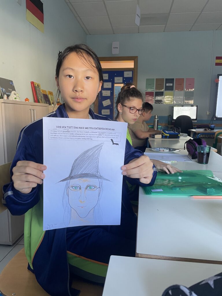Picture of student with drawing