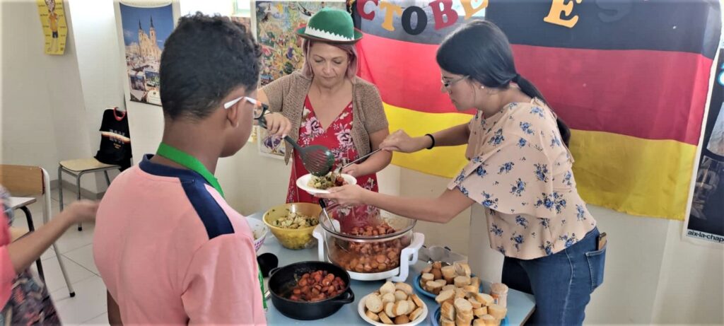 picture of student and teacher with food